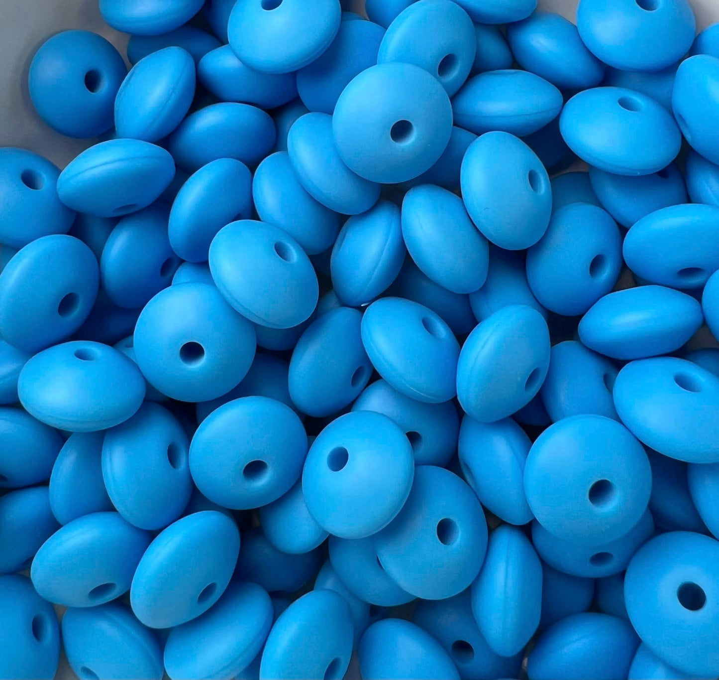 Bag of 100 12mm Sky Solid Silicone Lentil Beads