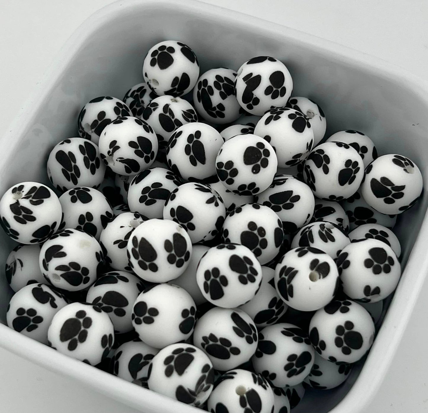 Pack of 100 15MM Black Paw Prints on White beads