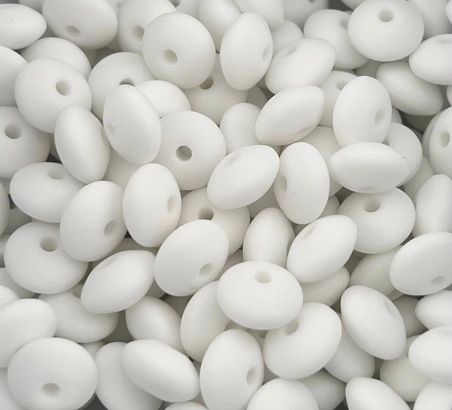 Bag of 100 12mm White Solid Silicone Lentil Beads