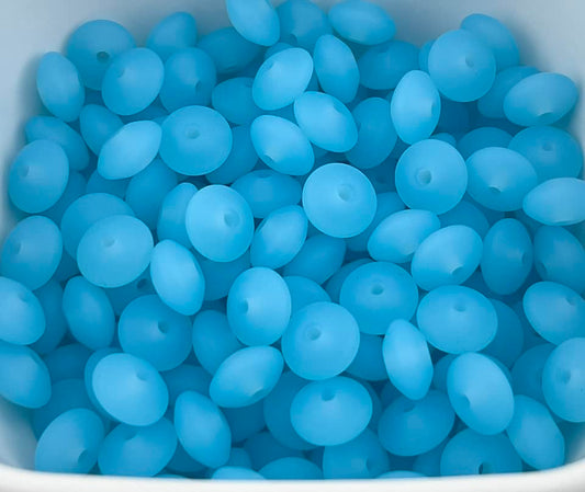Bag of 100 12mm Clear Blue Solid Silicone Lentil Beads